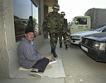 Kosovo trip
Members of the 40th engineers stationed at Camp Monteith, walk a foot patrol through the town of Gjilan.
Sgt. Albert Rodriguez, front, and Cpl. Todd Neroni, pass a begger on the street.